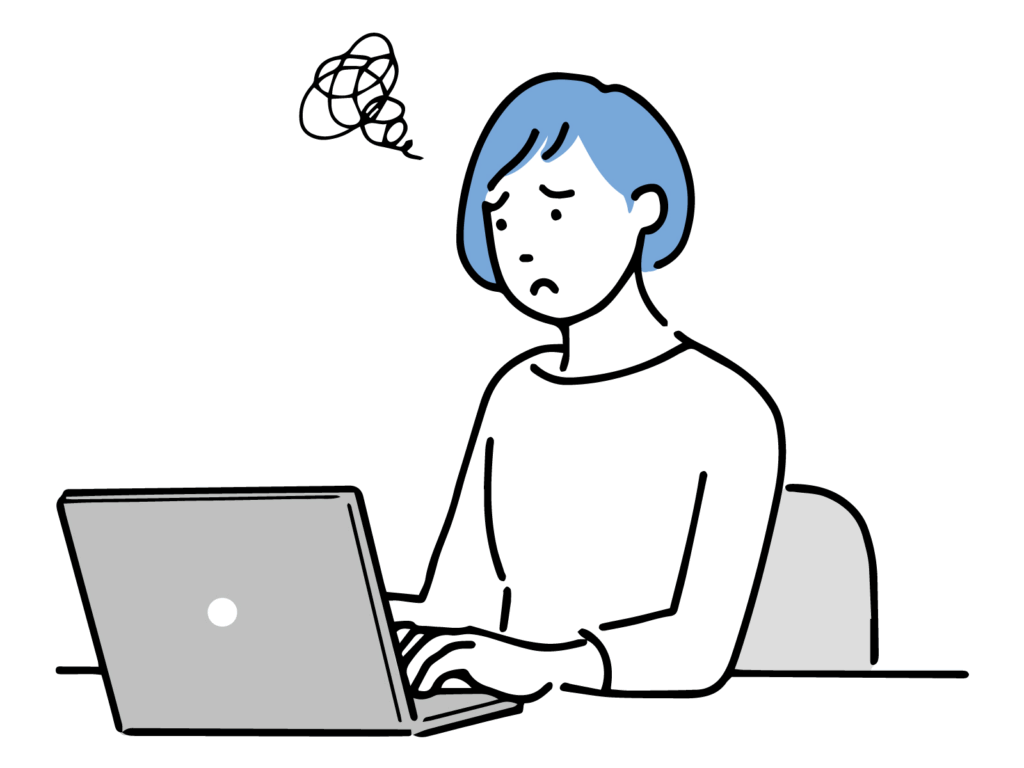 パソコンを操作しながら悩む女性